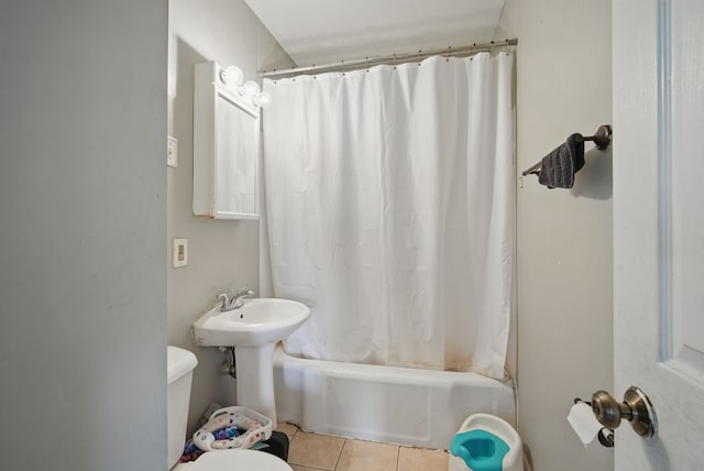 2057 Maple St, Des Moines, IA 50317 - bathroom featuring tile patterned floors, toilet, and shower / bathtub combination with curtain