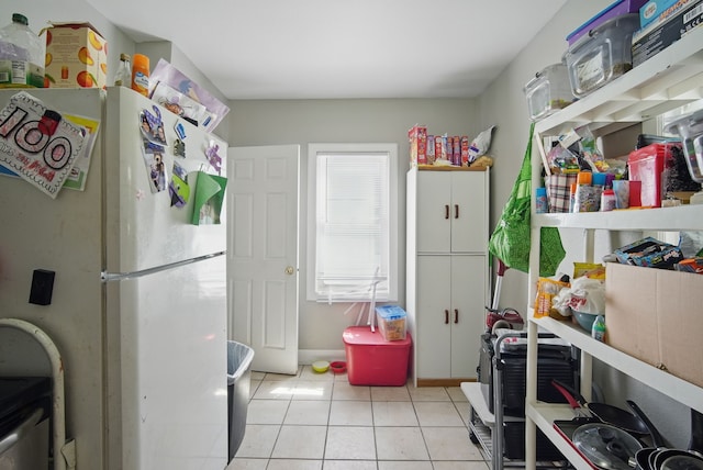 2057 Maple St, Des Moines, IA 50317 - washroom with light tile patterned floors and baseboards