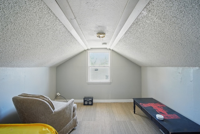 2057 Maple St, Des Moines, IA 50317 - bonus room featuring a textured ceiling, wood finished floors, lofted ceiling, and baseboards