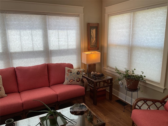 living room featuring wood finished floors and baseboards