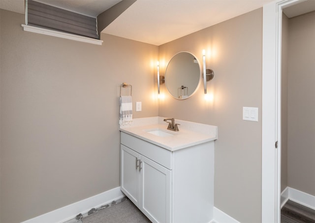 bathroom featuring vanity and baseboards