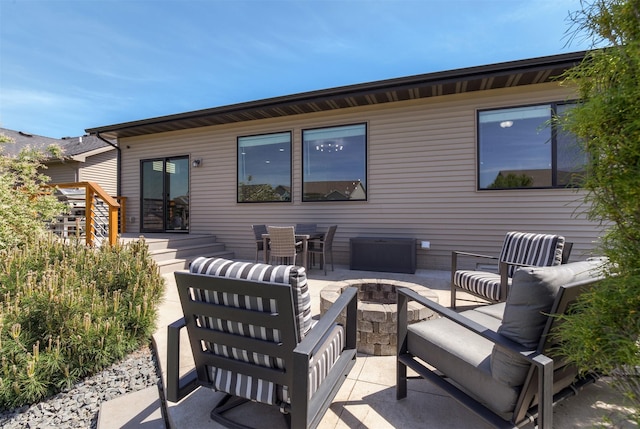 501 SE 15th St, Grimes, IA 50111 - back of property featuring a patio and an outdoor living space with a fire pit