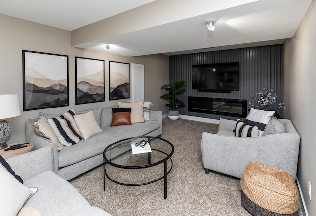 carpeted living room featuring baseboards