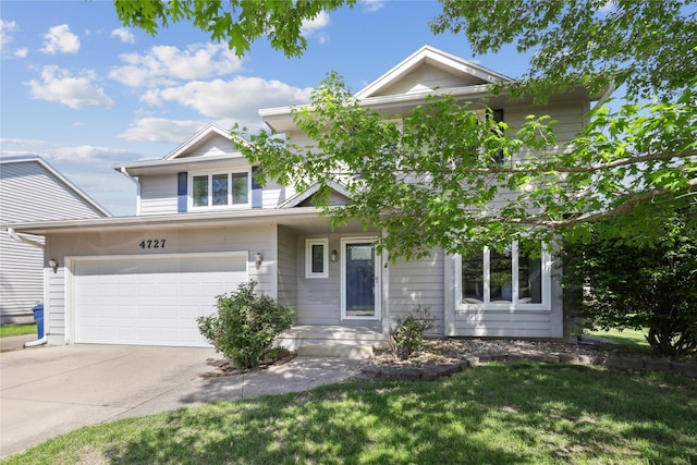 4727 80th Pl, Urbandale, IA 50322 - view of front of house featuring driveway, a garage, and a front yard