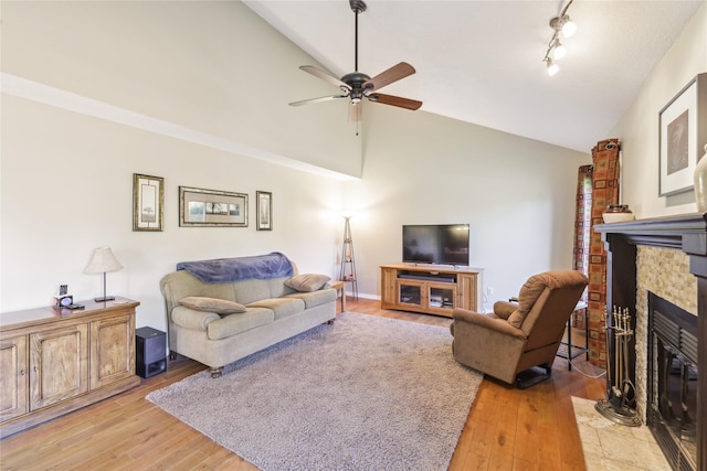 4727 80th Pl, Urbandale, IA 50322 - living room with ceiling fan, a fireplace with flush hearth, light wood-type flooring, and high vaulted ceiling