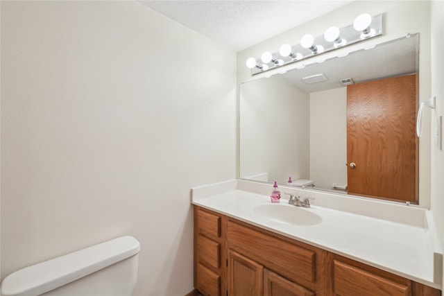 4727 80th Pl, Urbandale, IA 50322 - bathroom featuring toilet and vanity
