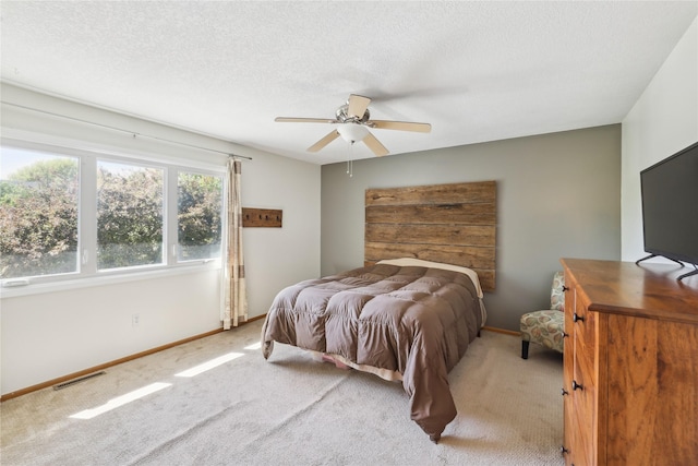 4727 80th Pl, Urbandale, IA 50322 - bedroom featuring light colored carpet, a ceiling fan, and a textured ceiling
