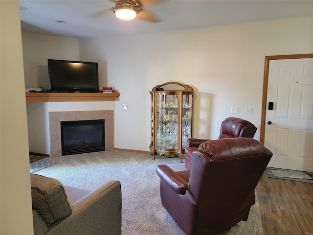 1210 NE 6th Ln Unit I9, Ankeny, IA 50021 - living room with a ceiling fan, a fireplace, wood finished floors, and carpet flooring