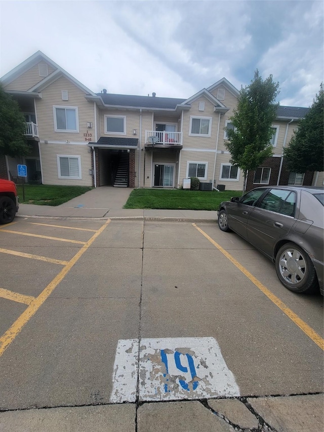 1210 NE 6th Ln Unit I9, Ankeny, IA 50021 - view of property featuring uncovered parking