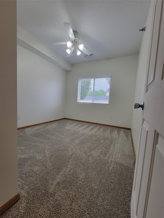 1210 NE 6th Ln Unit I9, Ankeny, IA 50021 - carpeted empty room featuring a textured ceiling and a ceiling fan