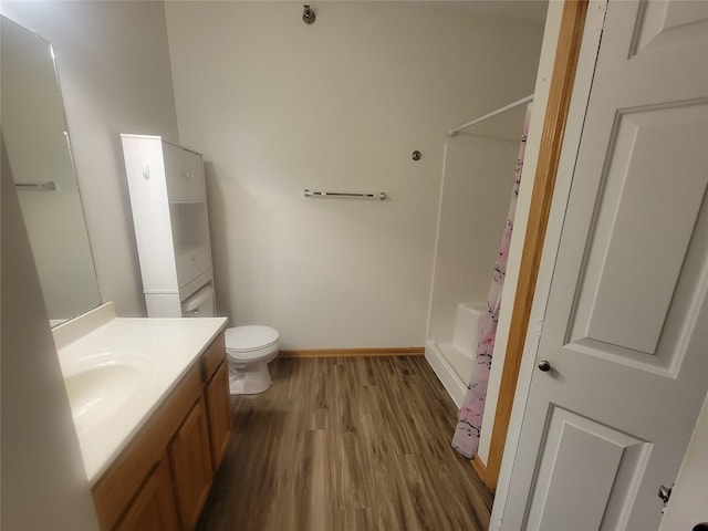 1210 NE 6th Ln Unit I9, Ankeny, IA 50021 - bathroom featuring vanity, wood finished floors, and shower / bathtub combination with curtain
