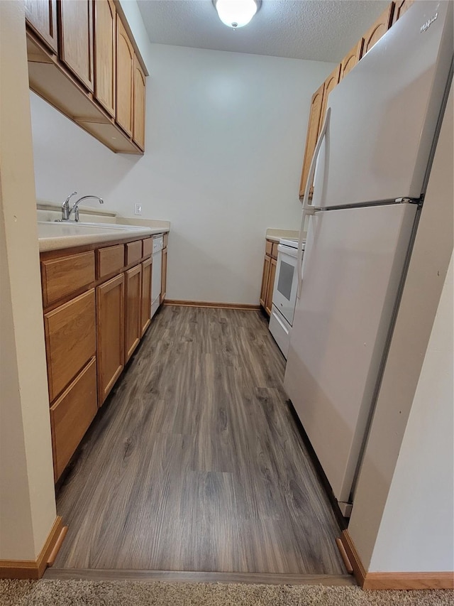 1210 NE 6th Ln Unit I9, Ankeny, IA 50021 - kitchen with white appliances, dark wood-style flooring, and light countertops