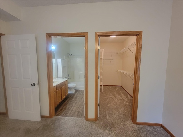 1210 NE 6th Ln Unit I9, Ankeny, IA 50021 - bathroom featuring bathtub / shower combination, vanity, and a spacious closet