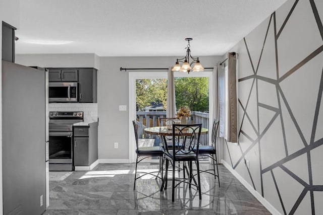 518 Maxwelton Dr, Des Moines, IA 50315 - dining space featuring baseboards, dark marble finish floors, and a chandelier
