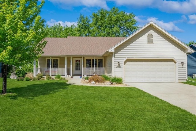 4480 88th St, Urbandale, IA 50322 - single story home featuring a porch, driveway, a garage, and a front lawn