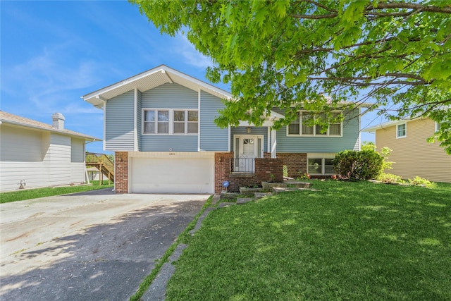 4021 80th St, Urbandale, IA 50322 - bi-level home featuring driveway, brick siding, a front lawn, and an attached garage