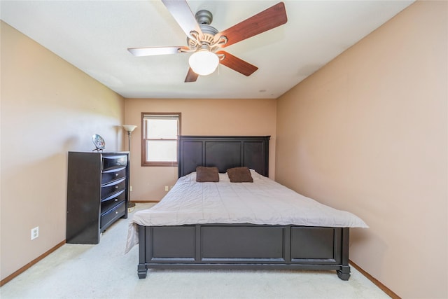 4021 80th St, Urbandale, IA 50322 - bedroom featuring light colored carpet, baseboards, and a ceiling fan