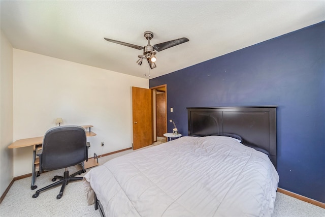 4021 80th St, Urbandale, IA 50322 - bedroom with carpet floors, baseboards, ceiling fan, and a desk
