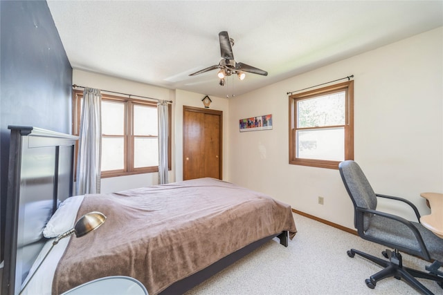 4021 80th St, Urbandale, IA 50322 - bedroom featuring carpet flooring, baseboards, and a ceiling fan