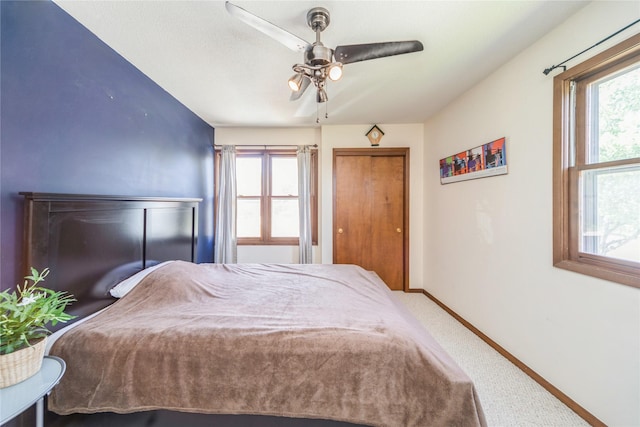 4021 80th St, Urbandale, IA 50322 - carpeted bedroom featuring baseboards, a ceiling fan, and a closet