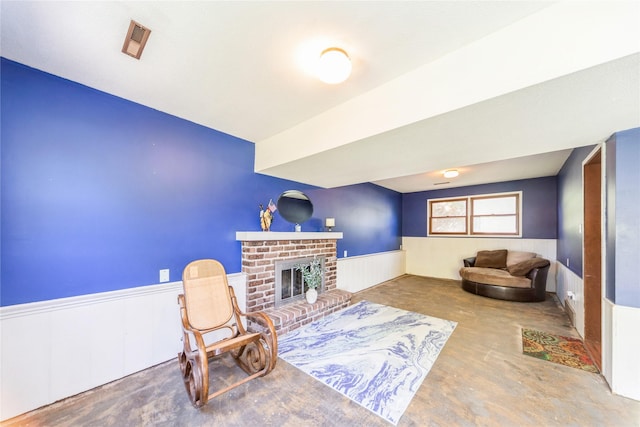 4021 80th St, Urbandale, IA 50322 - sitting room with wainscoting and a fireplace