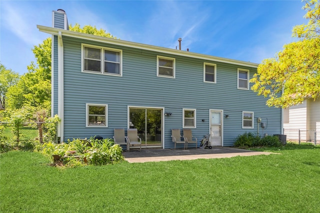 4021 80th St, Urbandale, IA 50322 - rear view of house featuring a patio area and a chimney