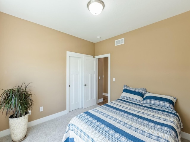 bedroom featuring carpet floors and baseboards
