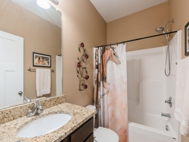 full bathroom featuring shower / tub combo, vanity, and toilet
