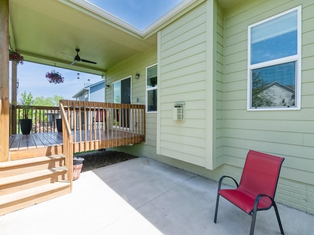 view of patio featuring a ceiling fan and a deck