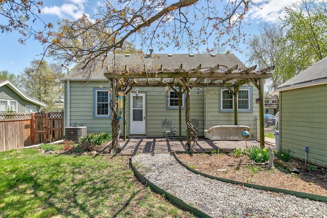 2400 39th St, Des Moines, IA 50310 - back of property with fence, a pergola, cooling unit, a patio area, and a shingled roof