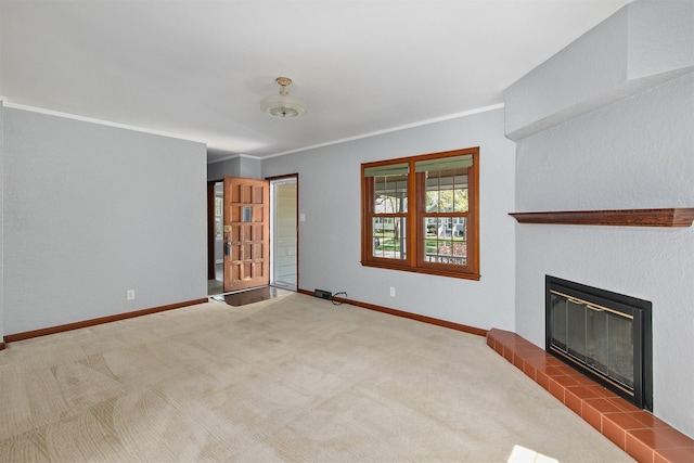 2400 39th St, Des Moines, IA 50310 - unfurnished living room featuring a tile fireplace, baseboards, carpet flooring, and ornamental molding