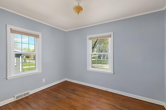 2400 39th St, Des Moines, IA 50310 - unfurnished room with baseboards, dark wood-type flooring, and crown molding