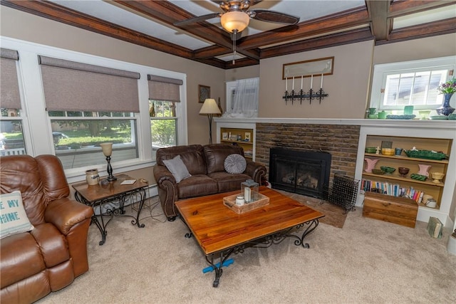 living room with coffered ceiling, carpet flooring, a ceiling fan, a brick fireplace, and beam ceiling