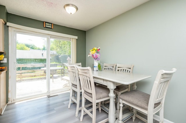 102 Wall Ave, Des Moines, IA 50315 - dining area featuring wood finished floors