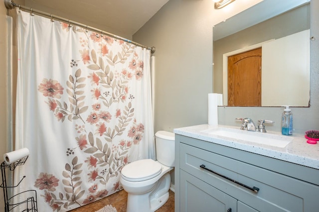 102 Wall Ave, Des Moines, IA 50315 - full bathroom with toilet, vanity, tile patterned floors, and a shower with shower curtain