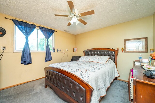 102 Wall Ave, Des Moines, IA 50315 - carpeted bedroom featuring a textured ceiling, baseboards, and a ceiling fan