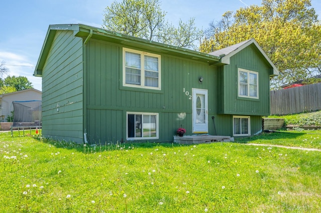 102 Wall Ave, Des Moines, IA 50315 - rear view of house with a trampoline