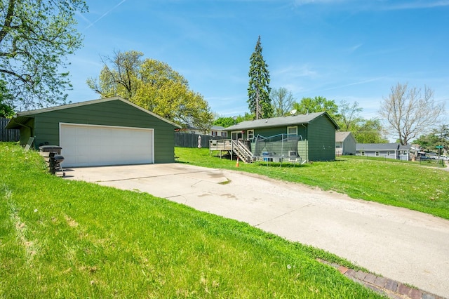 102 Wall Ave, Des Moines, IA 50315 - ranch-style home featuring a detached garage and an outbuilding