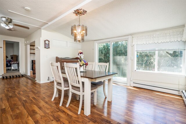 dining area with a chandelier, wood finished floors, a textured ceiling, baseboards, and a ceiling fan