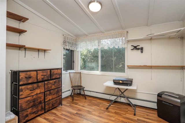 sitting room with wood finished floors and a baseboard radiator