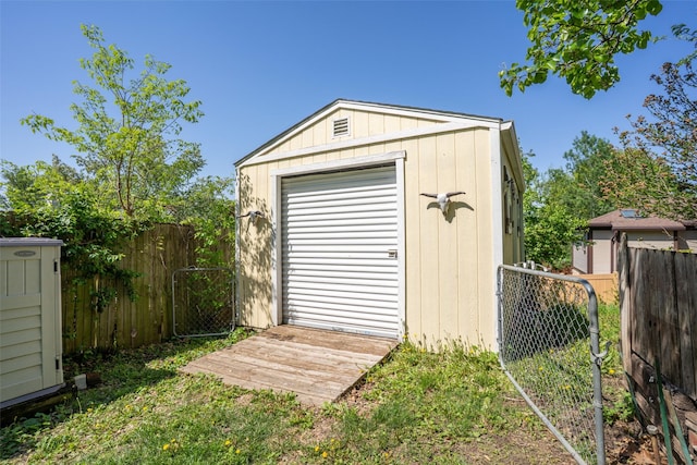 view of shed featuring fence