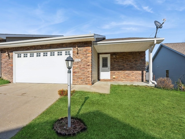 1132 S Goodrich St, Colfax, IA 50054 - view of front of property featuring an attached garage, concrete driveway, a front yard, brick siding, and stone siding