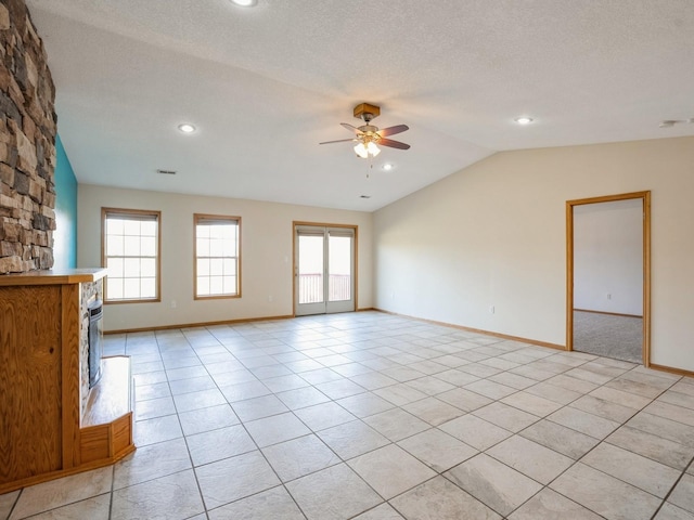 1132 S Goodrich St, Colfax, IA 50054 - unfurnished living room featuring lofted ceiling, a ceiling fan, baseboards, light tile patterned flooring, and recessed lighting