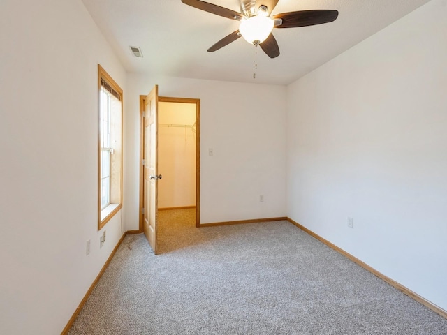 1132 S Goodrich St, Colfax, IA 50054 - empty room with light colored carpet, healthy amount of natural light, and baseboards