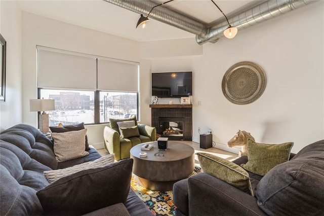 400 E Locust St Unit 203, Des Moines, IA 50309 - living area with a fireplace and wood finished floors