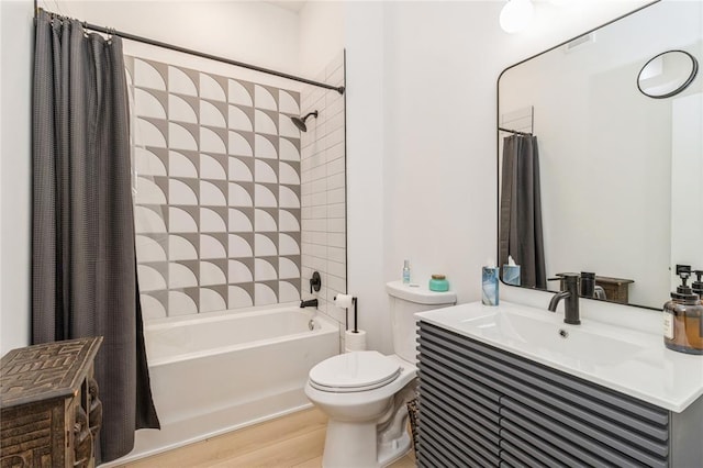 400 E Locust St Unit 203, Des Moines, IA 50309 - bathroom with shower / bath combination with curtain, toilet, vanity, and wood finished floors