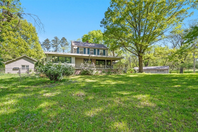 3936 Hubbell Ave, Des Moines, IA 50317 - back of house featuring a yard, a porch, and an outdoor structure