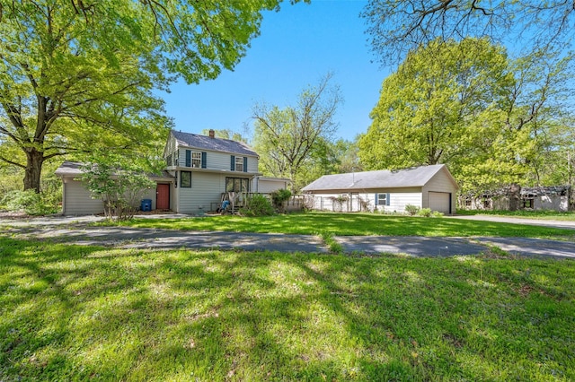 3936 Hubbell Ave, Des Moines, IA 50317 - traditional home featuring a chimney and a front yard