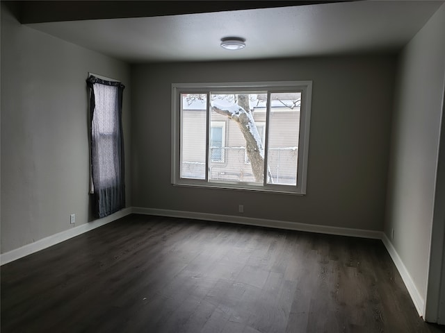 1344 21st St, Des Moines, IA 50311 - empty room with dark wood finished floors and baseboards