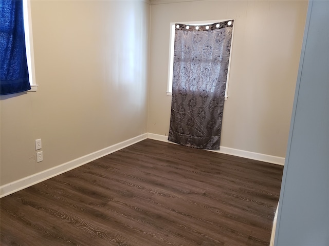 1344 21st St, Des Moines, IA 50311 - spare room featuring dark wood-style floors and baseboards